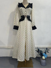Classic polka dot midi shown for chic spring brunch and desk-to-dinner style