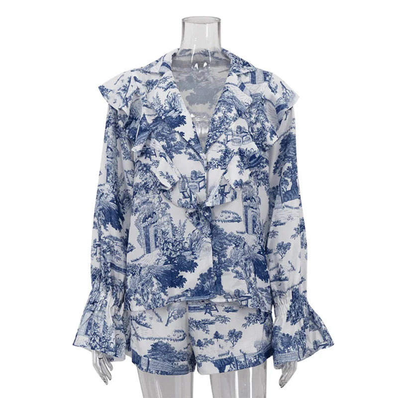 Mannequin wearing a floral print shirt with flare sleeves and button details on a white background