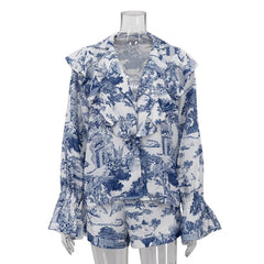 Mannequin wearing a floral print shirt with flare sleeves and button details on a white background