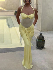 Close-up of ruched detail and sculpting mesh on yellow maxi dress