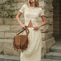 Close-up of ruched knit detailing on matching two-piece summer outfit