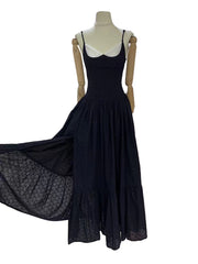 “Close-up of slimming folds and square neckline detail on mesh dress”