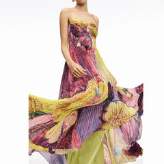 Flowy pleated strapless summer dress twirling with motion and color