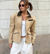 Contrast-collar zip jacket with tailored seams and pocket trim