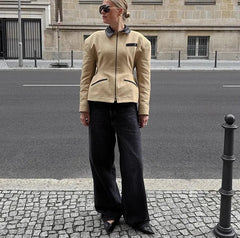 Structured zip jacket styled with denim for a polished casual look