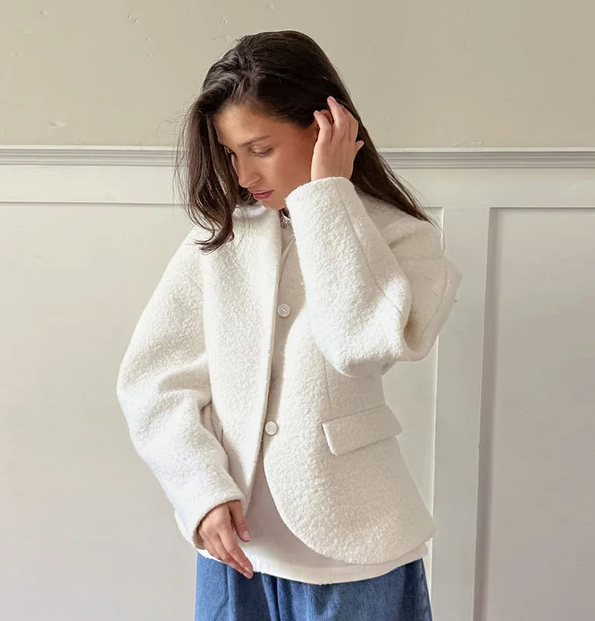 A close-up of the soft faux fur fabric and the open-stitch design.