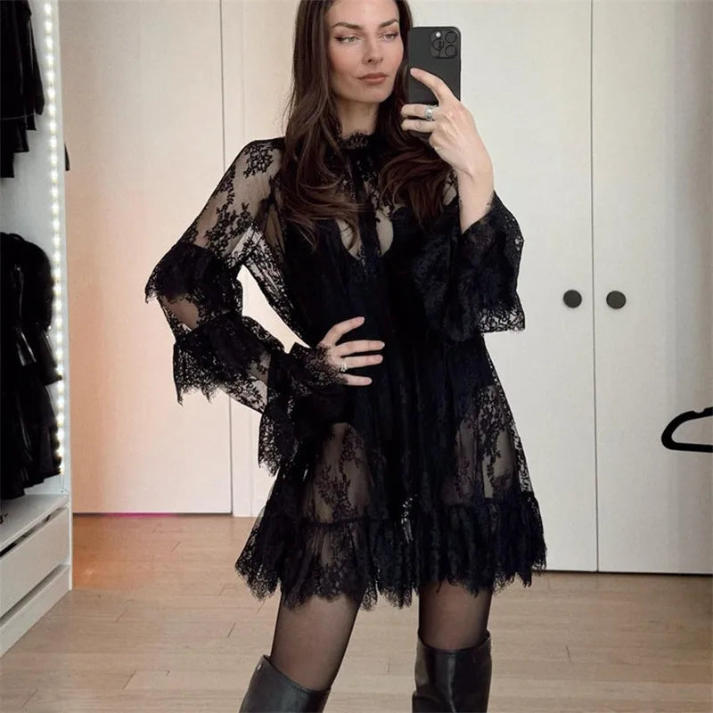 A front view of the crew-neck lace dress, showing the intricate lace pattern.