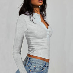 Cropped polo top styled casually with high-waisted jeans for a relaxed everyday look.