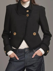 Close view of the jacket’s gold-tone buttons and stand collar, highlighting the structured fabric and clean front finish.