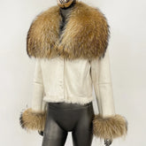 Cropped suede jacket shown on a mannequin, highlighting the plush fur collar and clean structured front