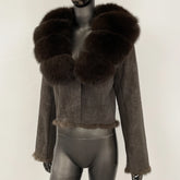 Cropped suede jacket with rich brown fur collar displayed front-facing on a mannequin against a neutral studio backdrop