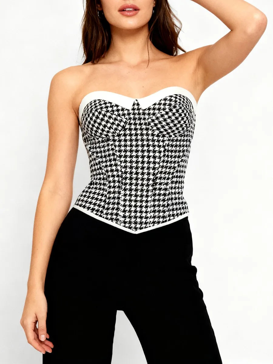 Full view of a cropped strapless corset top with gingham pattern styled for warm-weather daywear and minimalist accessories.