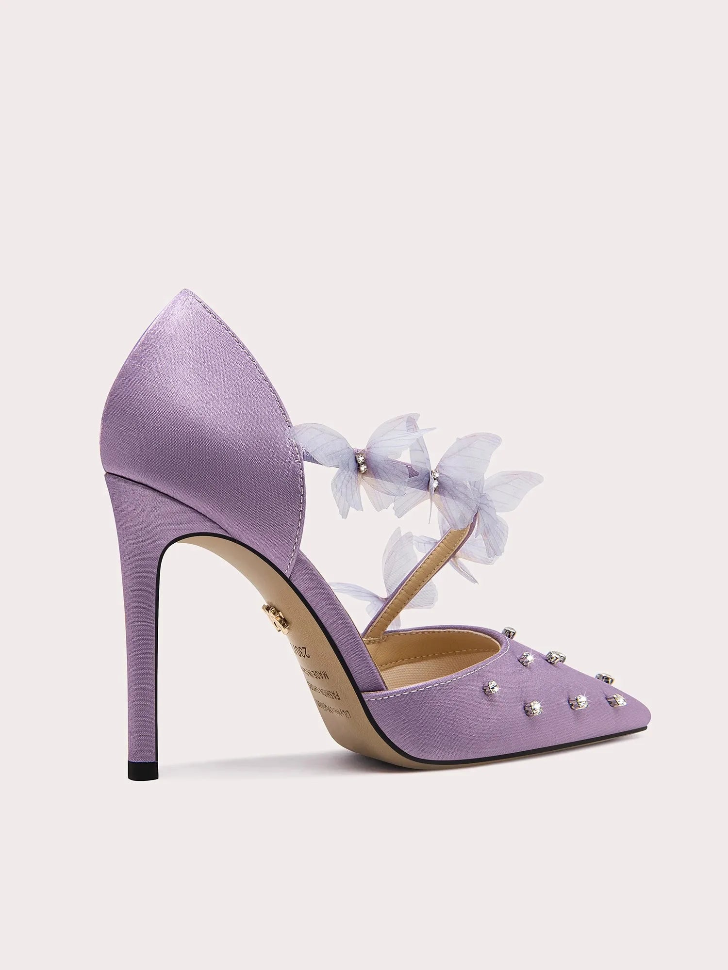 A close-up of the crystal and lace detail on the shoe.