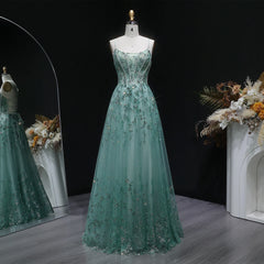 Crystal appliqué tulle A-line gown with spaghetti straps and boat neckline