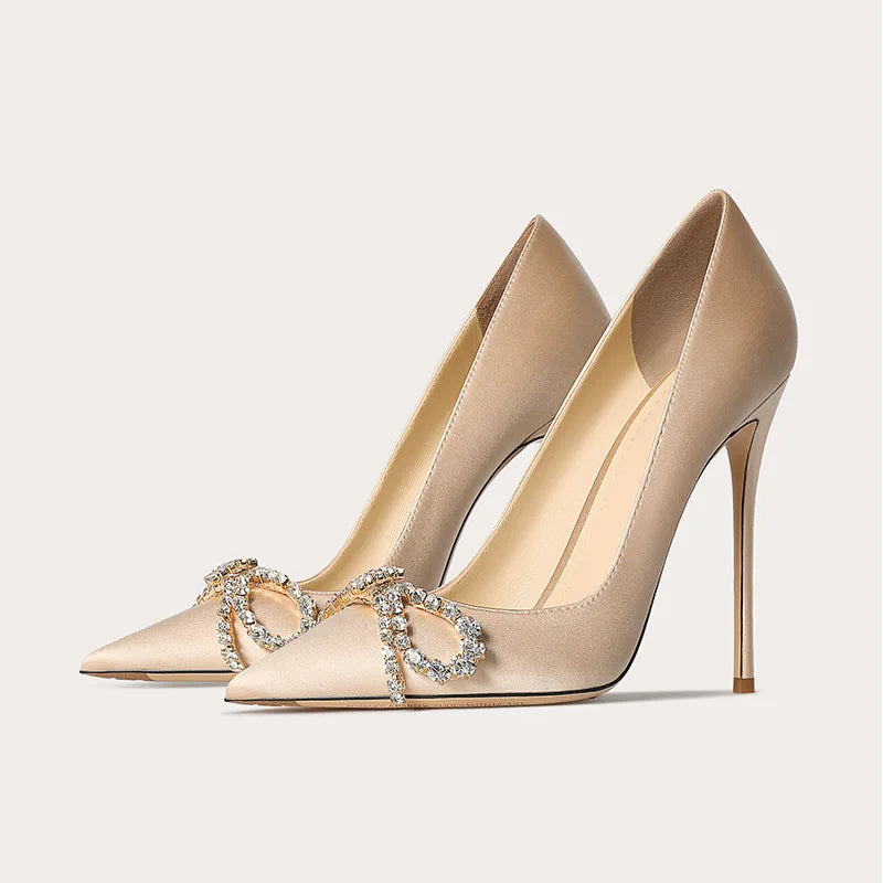Crystal bow pointed pumps styled for gala and evening wear