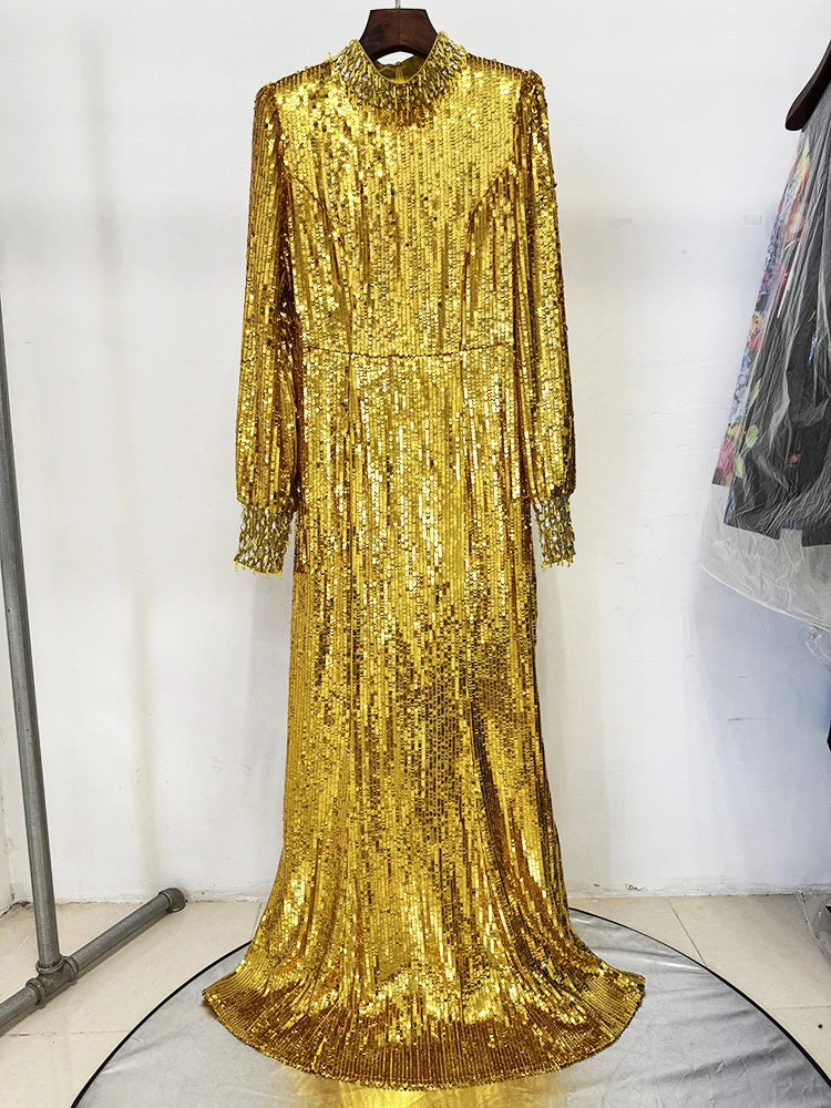 High-neck gold evening gown with full sleeves shown in a sleek formal look.