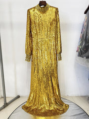High-neck gold evening gown with full sleeves shown in a sleek formal look.