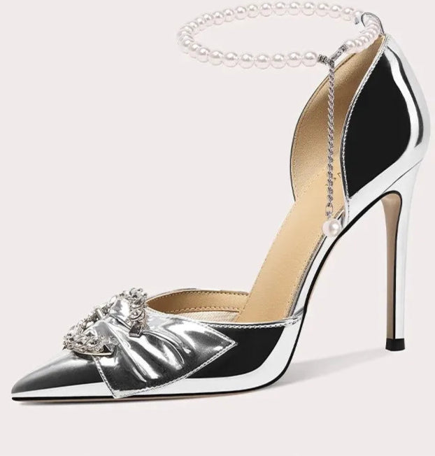 Crystal embellished party heels with metallic shine and statement bow