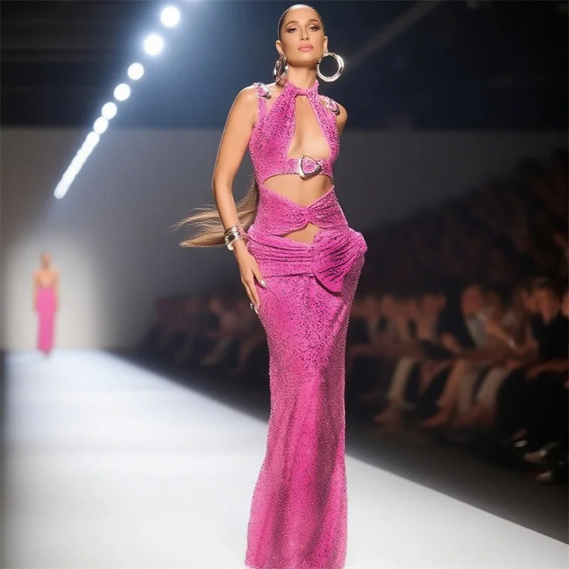 Cutout pink crystal gown with halter neckline walking a runway