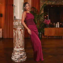 Close view of the satin bodice with soft drape and subtle sheer paneling, highlighting the clean neckline and smooth finish.