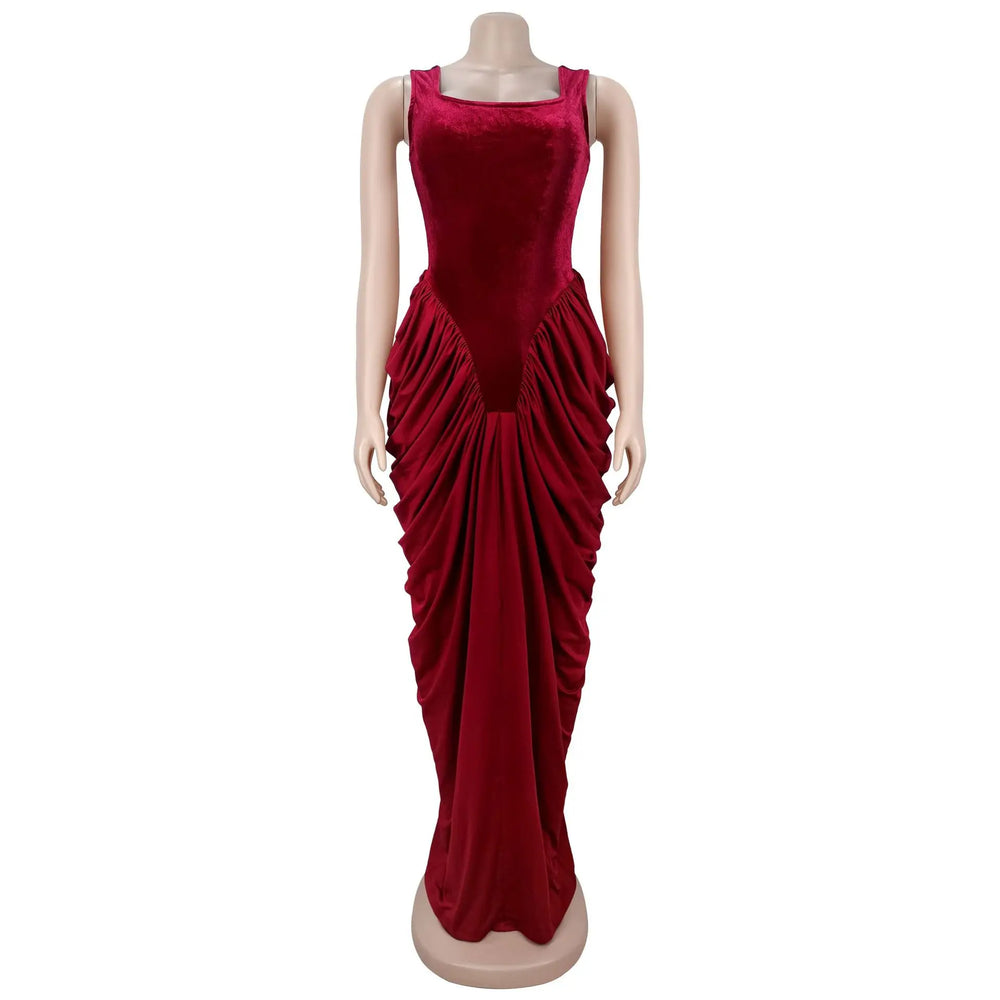 Detailed View highlighting the bodycon fit and floor-length hem of a deep red velvet-feel maxi dress in soft daylight.