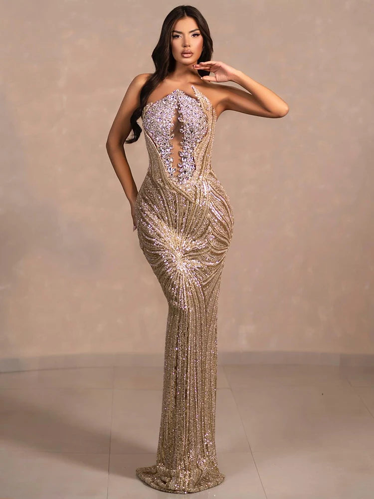 Diamond beaded strapless gold gown styled for formal high-society events