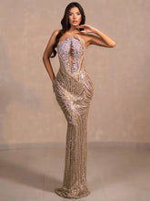 Diamond beaded strapless gold gown styled for formal high-society events