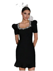 Black dress with decorative neckline on a white background