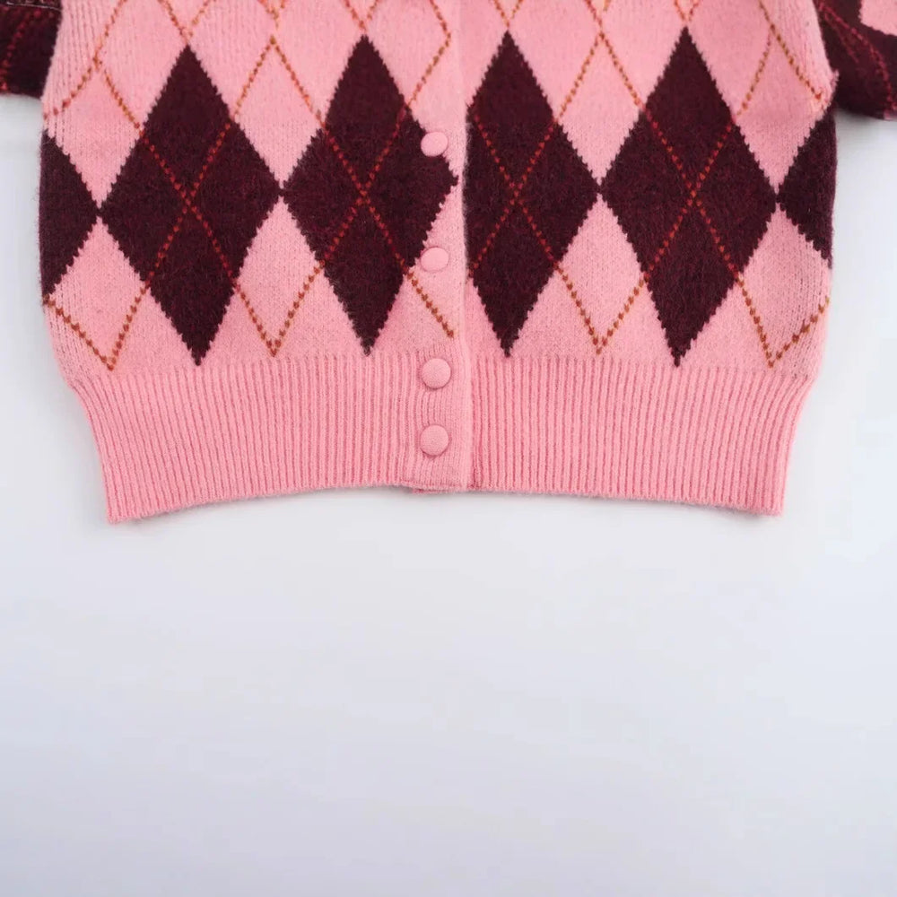 Close-up detail revealing the knit texture and layered diamond pattern across the fabric