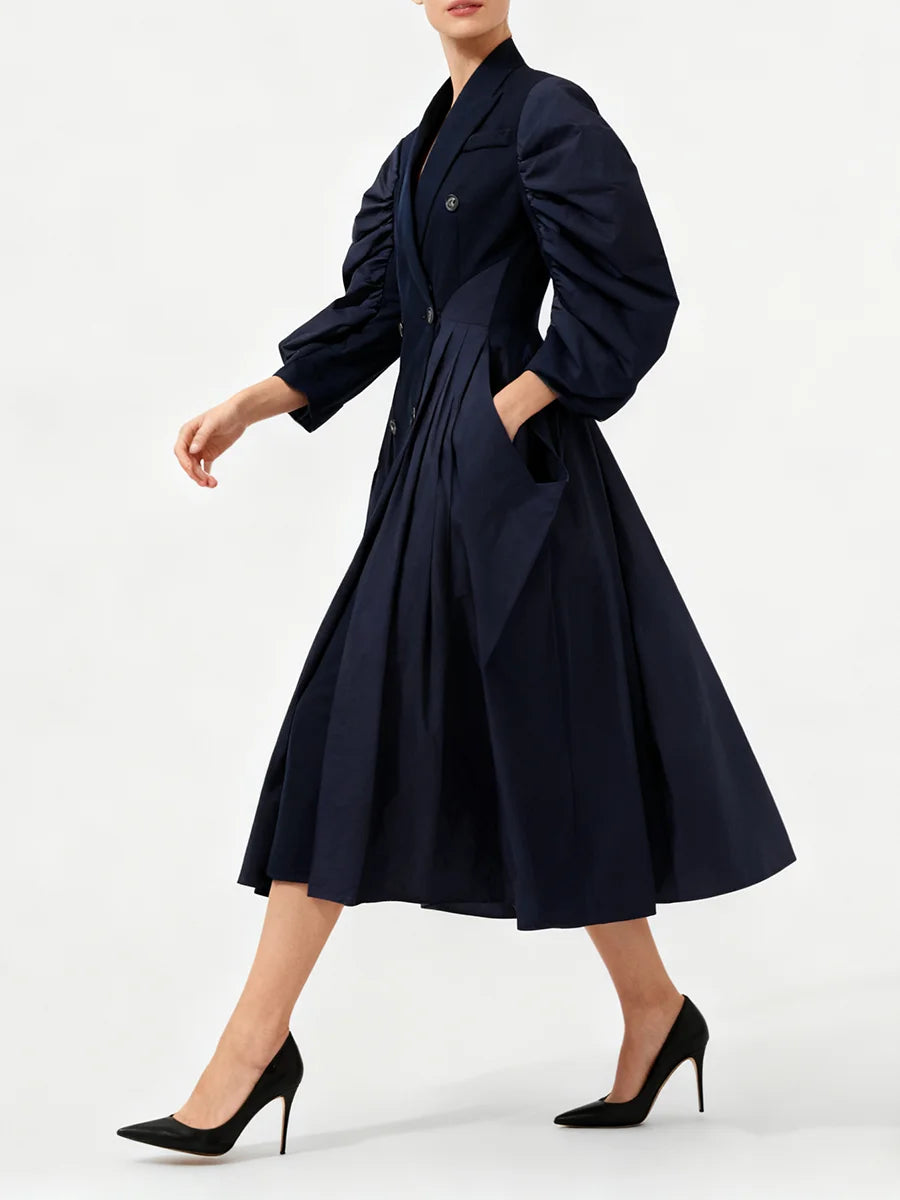 Tailored blue midi dress styled with structured collar and pockets