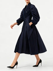 Tailored blue midi dress styled with structured collar and pockets