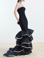 Dramatic tiered ruffle black gown in floor-length silhouette