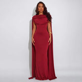 Long cape-draped maxi dress with open-back design