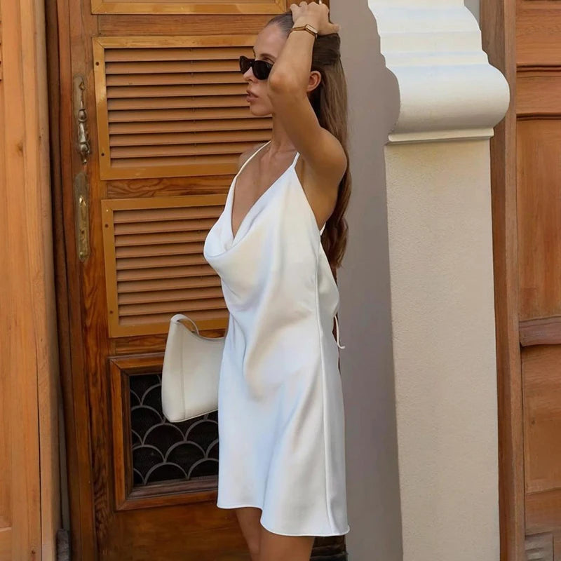 Women’s white slip dress with draped neckline for easy summer looks