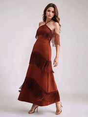 Woman wearing a dynamic editorial red fringe event gown with flowing movement dress on a white background