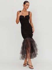 Elegant black evening dress with sheer hem and fitted silhouette
