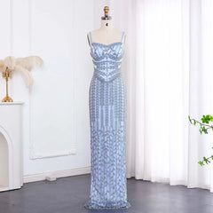 The full length of the elegant blue formal gown, showing its figure-hugging silhouette.