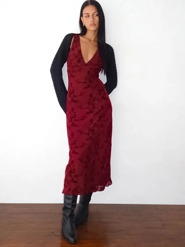 A full-length view of the elegant draped evening gown.