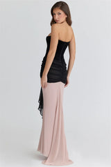 Side angle capturing the natural A-line silhouette and soft movement of the maxi skirt as the model shifts posture.