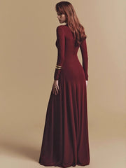Full-length evening gown on a plain background with long sleeves