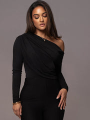Close-up of ruched neckline and sleeve detail on black off shoulder bodysuit