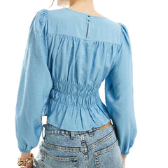 A back view of the elegant long-sleeve round-neck shirt.
