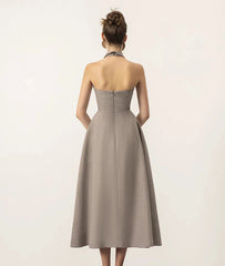 The back view of the dress, showing the elegant backless design.