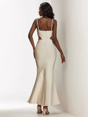 The back view of the dress, showing the elegant zipper closure.