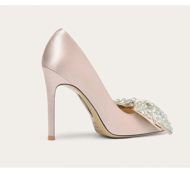 Elegant pink silk pointed stiletto pump available in large and small sizes for women on a light background