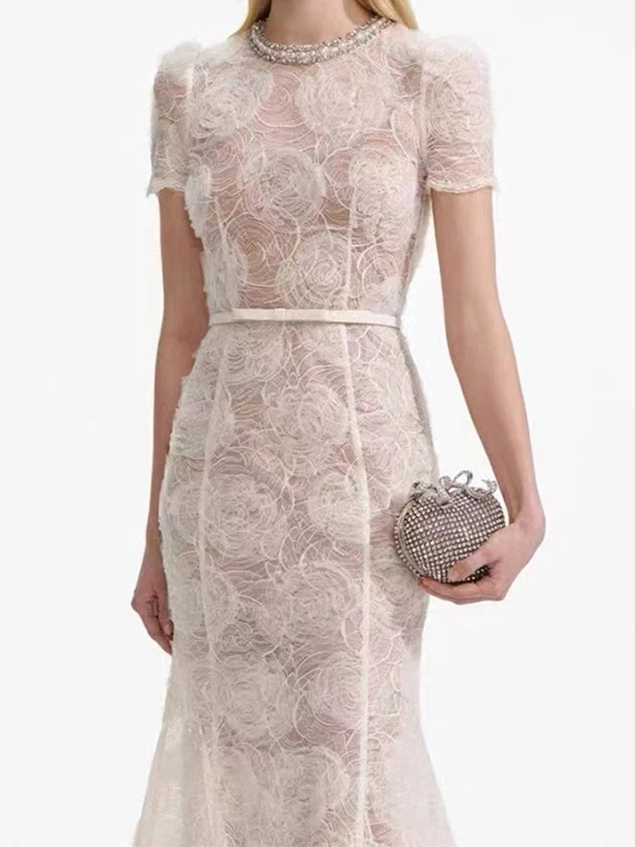 A front view of a women's round-neck belted dress, highlighting the A-line silhouette.