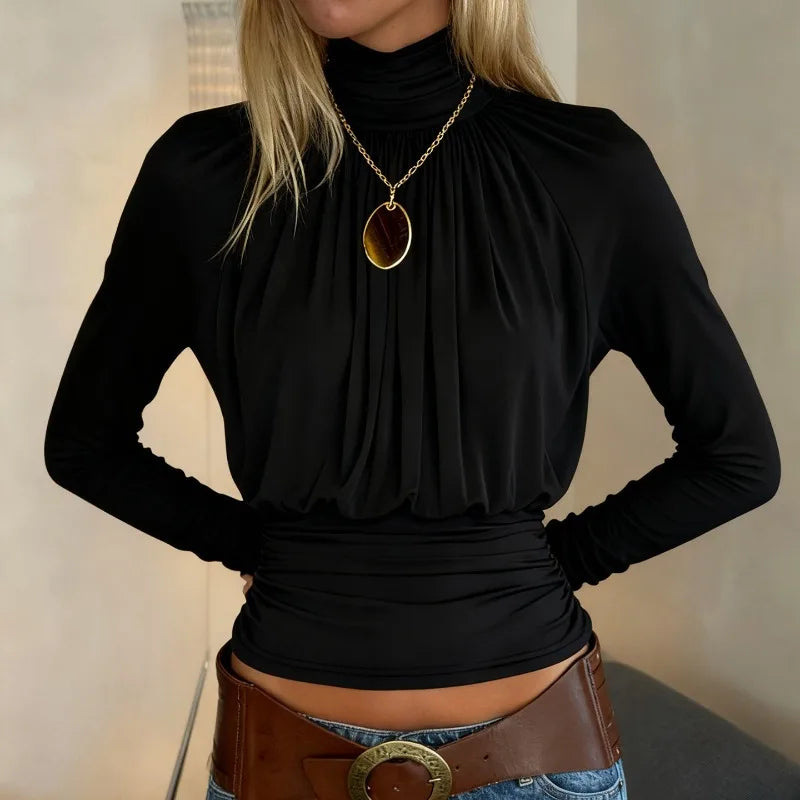 Long sleeve turtleneck top with refined front drape and cropped length