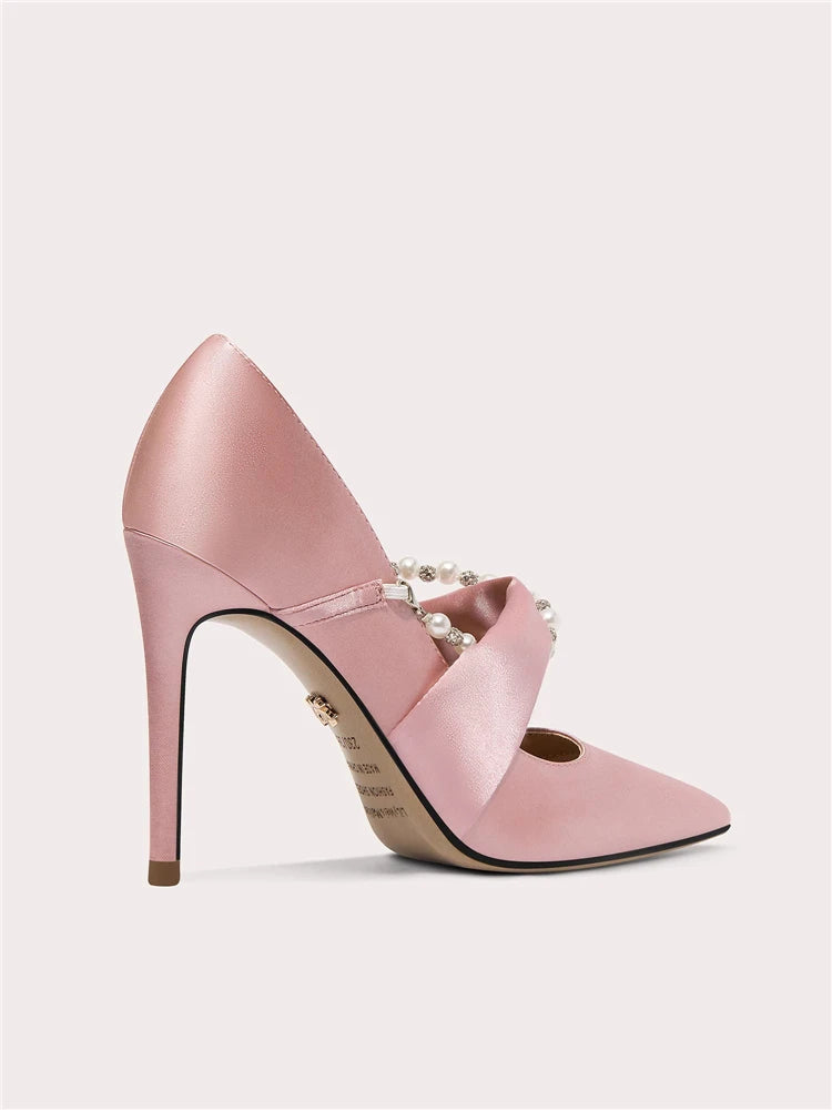 Side view of silk pumps with thin high heel and crystal accents