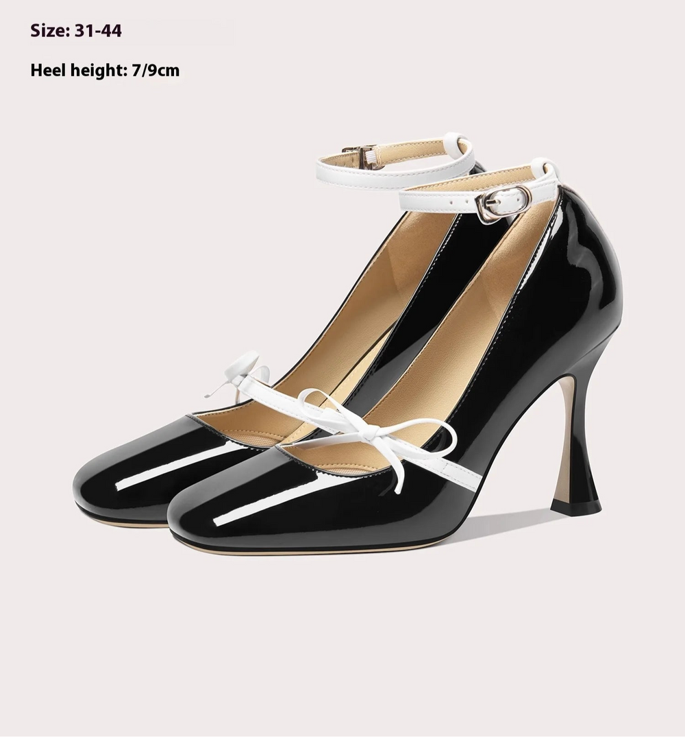 Close-up of patent leather square-toe bow pumps