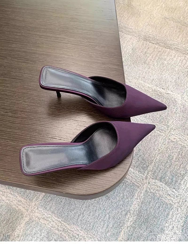Side view of elegant purple pointed toe mule shoes
